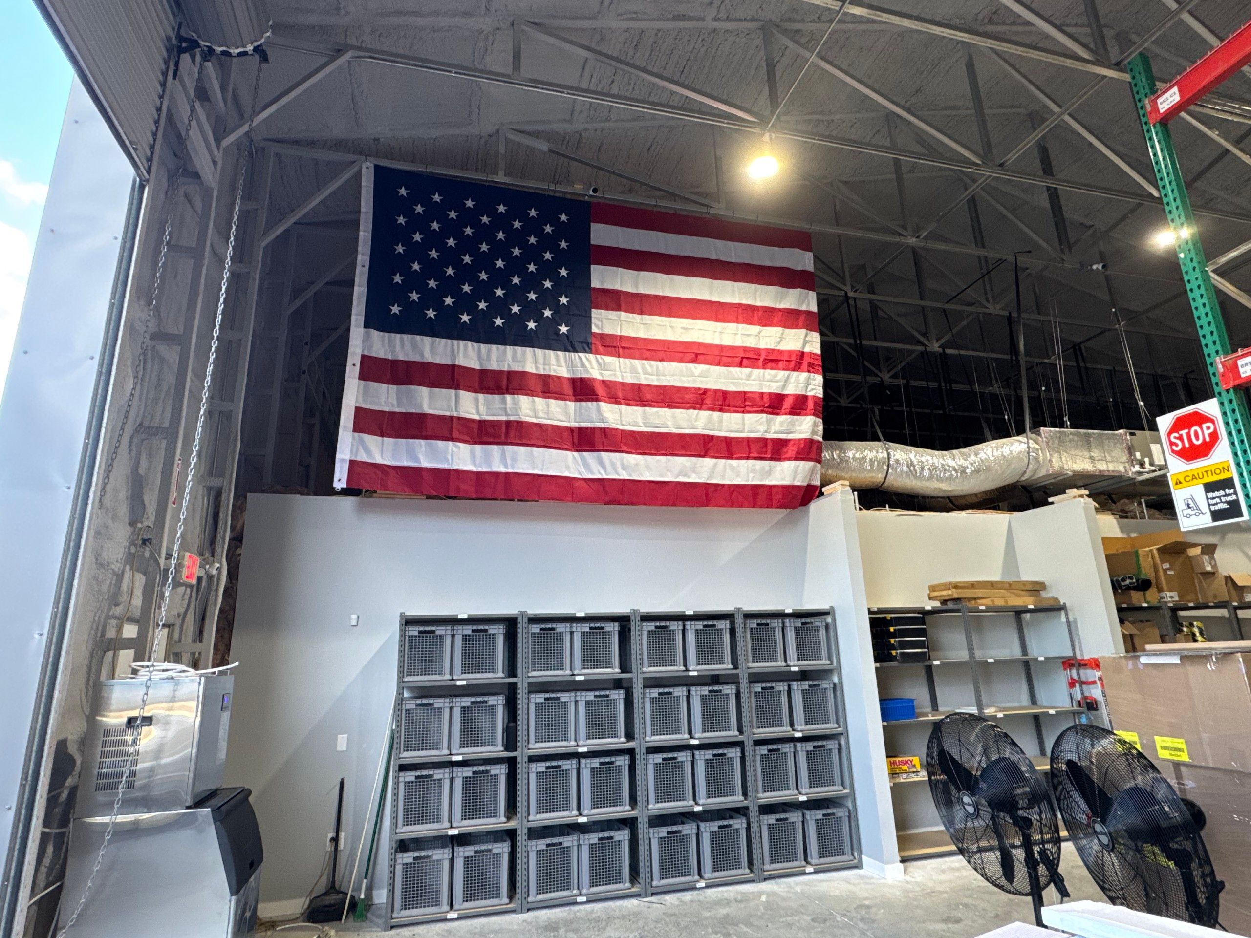 An American flag displayed inside the SESupply warehouse